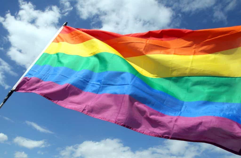 What is behind the rainbow flag